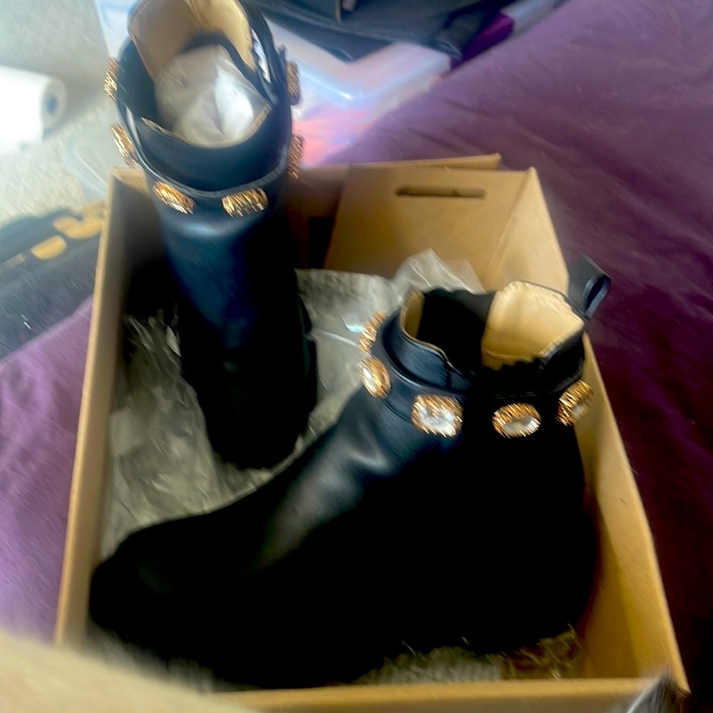 Steve Madden Amulet black ankle boot with rhinestone buckle around ankle